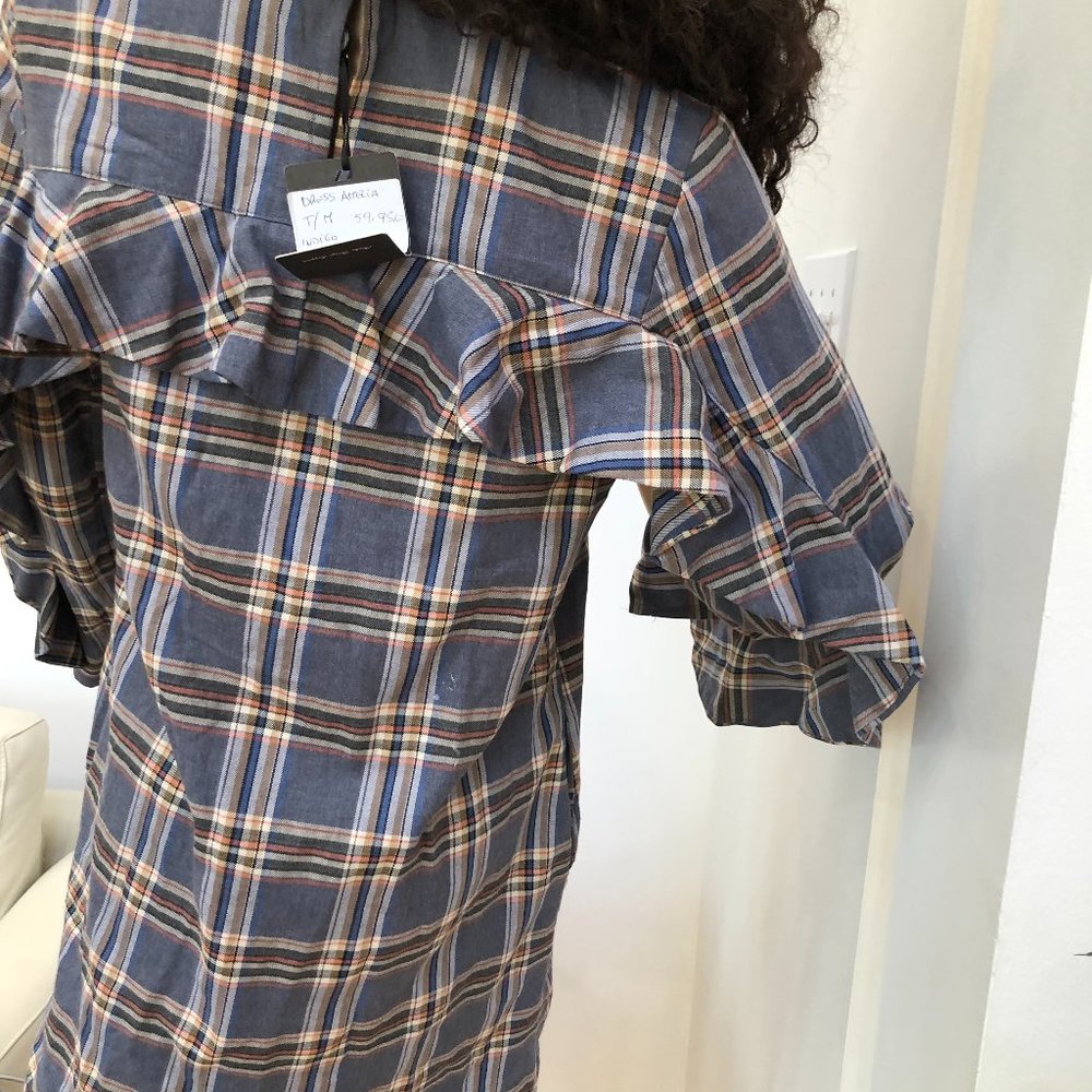 Plaid Babydoll Dress with exciting pleated sleeve and back detail!